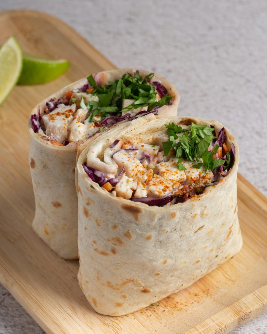 Golden breakfast wrap filled with egg and fresh ingredients